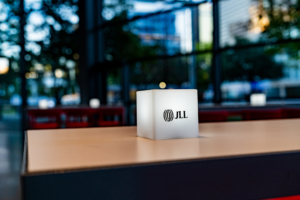 Custom soft-box lighting created with the JLL logo for table top